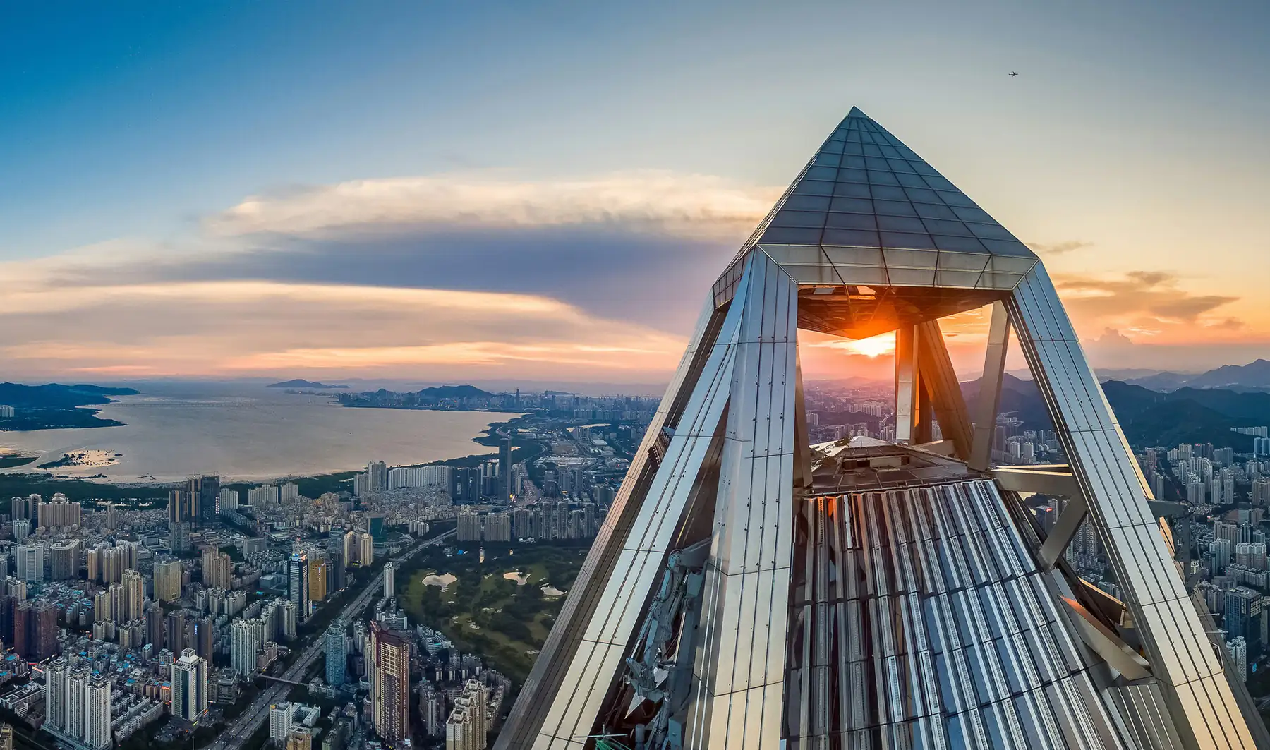 Shenzhen skyline and bay at sunset, viewed from a modern skyscraper