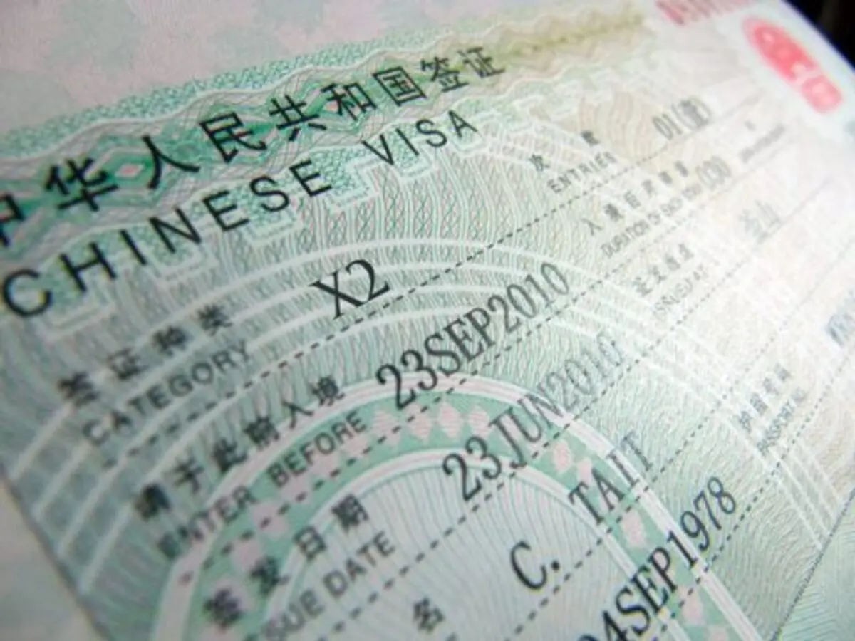 Close-up of a Chinese visa sticker in a passport
